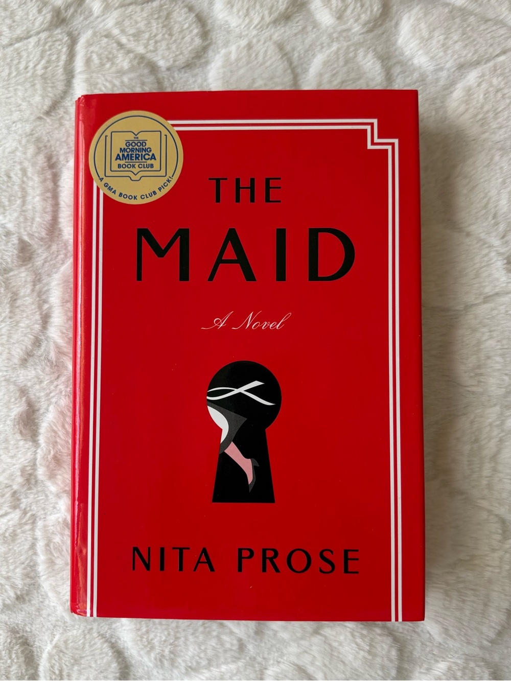 The Maid by Nita Prose - Red Hardcover Novel